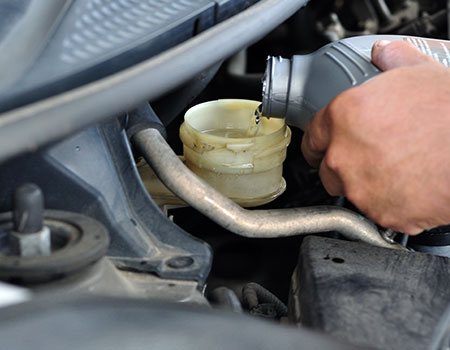 Find a store near you to have your brake fluid serviced. Image of brake fluid service.