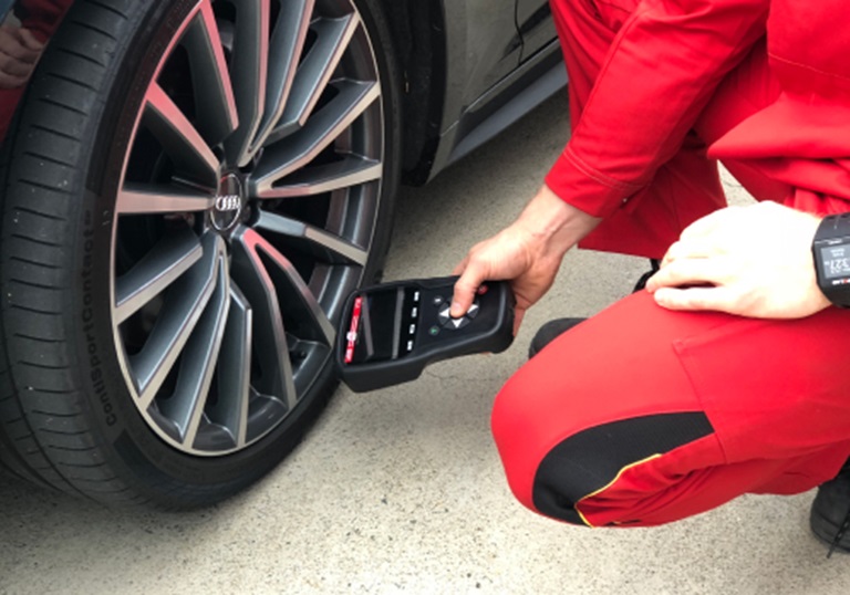 What should I do when a TPMS warning light is illuminated