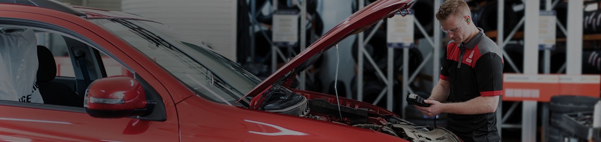 Car battery check by a qualified technicians to determine if a car battery replacement is required.