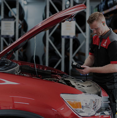 Car battery check by a qualified technicians to determine if a car battery replacement is required.