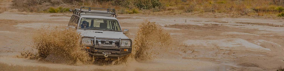 The best all terrain & mud terrain tyres for your 4WD. Image of off road driving.