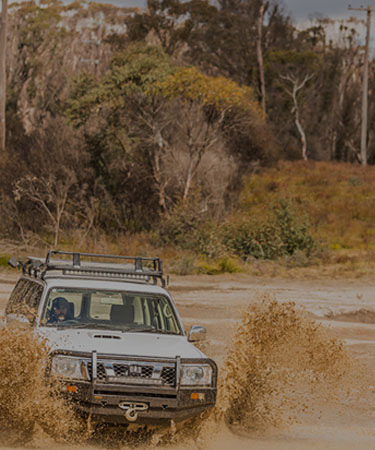 The best all terrain & mud terrain tyres for your 4WD. Image of off road driving.