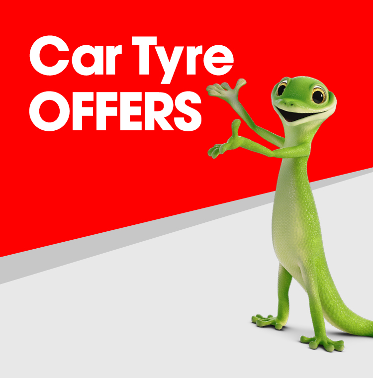 Car fitted with new tyres driving on the road